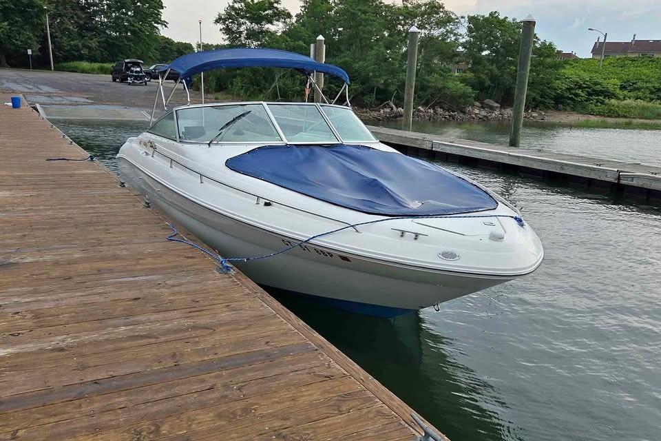 Sea Ray 280 Bow Rider 1999 Sea Ray 280 Bow Rider docked with blue cover and canopy.