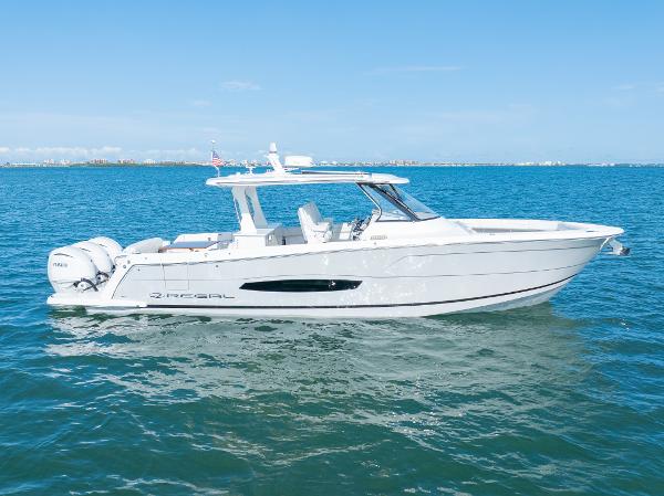 Regal 38 SAV 2023 Regal 38 SAV boat cruising on clear blue water.