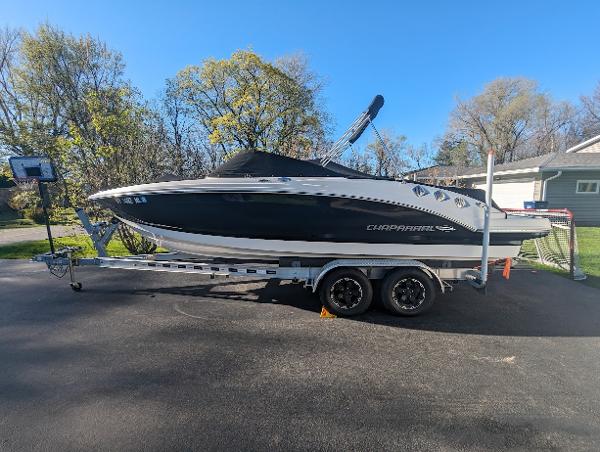 Chaparral 226 SSi 2015 Chaparral 226 SSi boat on trailer, parked outdoors.