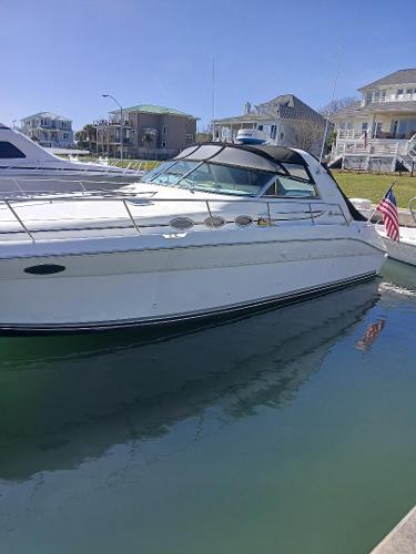 Sea Ray 370 Sundancer 1997 Sea Ray 370 Sundancer yacht docked in a marina, clear sky background.