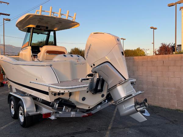 Chris-Craft Catalina 24 2024 Chris-Craft Catalina 24 boat with powerful outboard motor on a trailer.