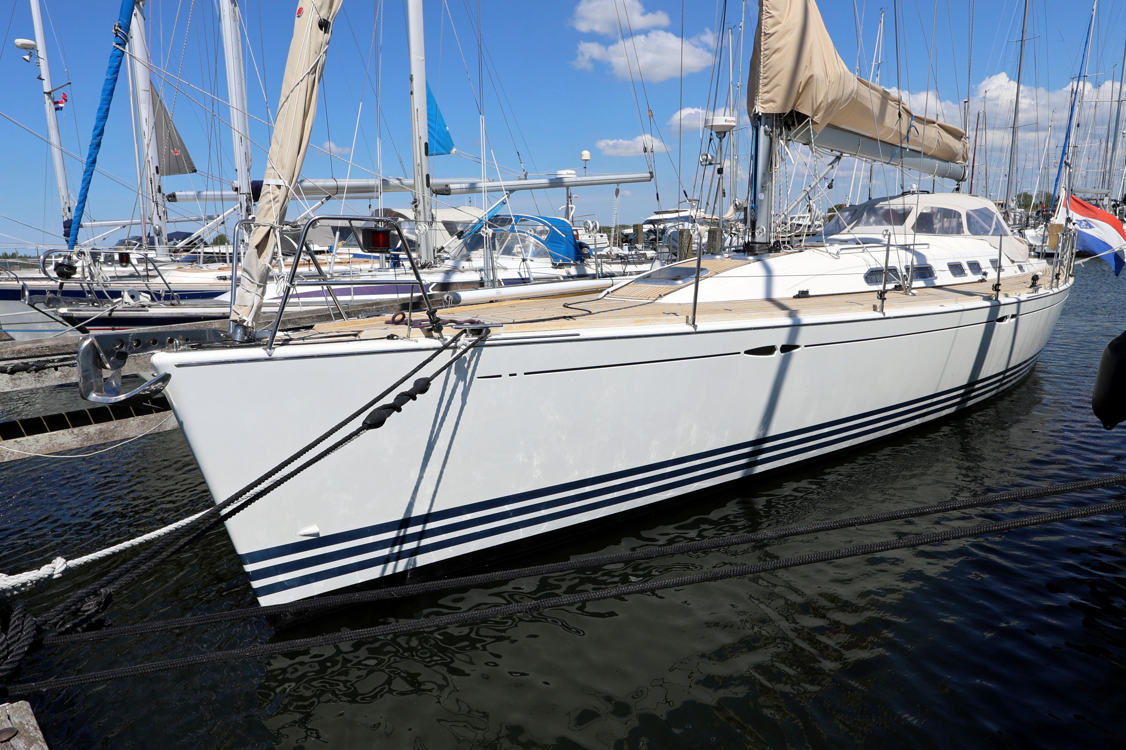 X-Yachts X-46 2006 X-Yachts X-46 sailboat docked in marina under clear blue sky.