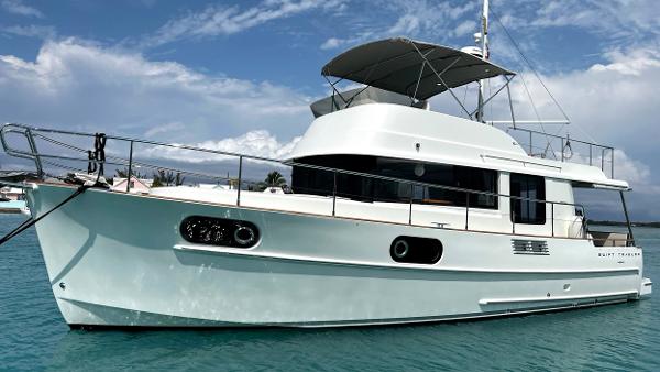 Beneteau Swift Trawler 44 2020 Beneteau Swift Trawler 44 on calm blue water under a partly cloudy sky.