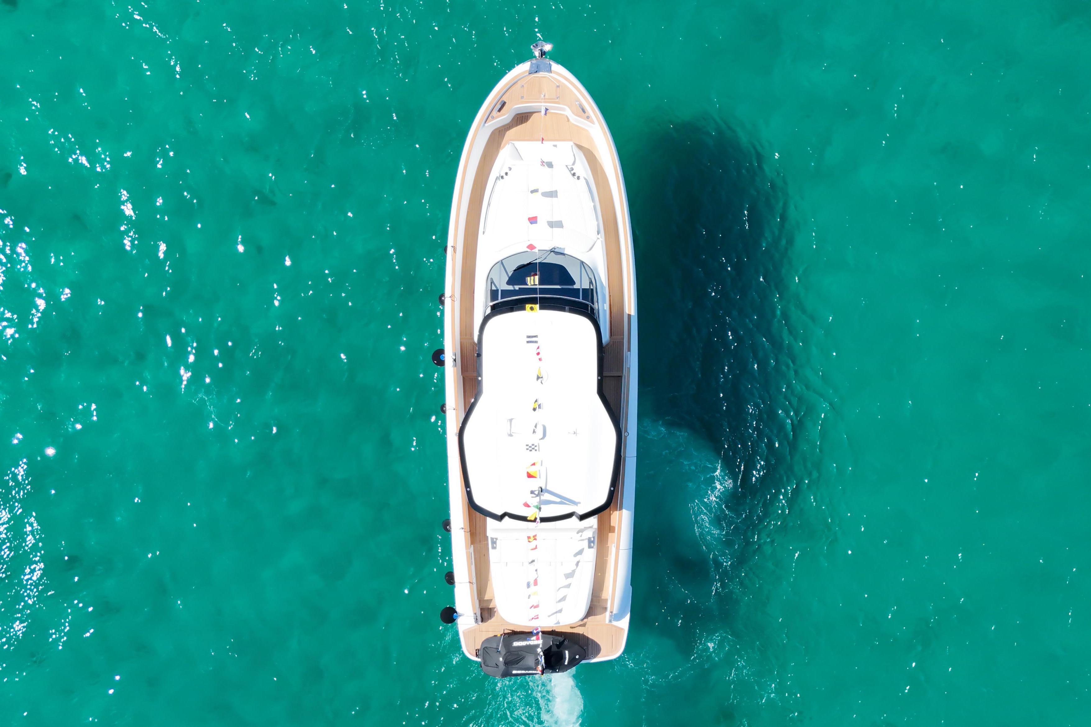 Solaris Power 52 open Aerial view of 2024 Solaris Power 52 Open yacht on turquoise water.