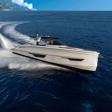 Solaris Power 52 open 2024 Solaris Power 52 Open yacht cruising on open sea with scenic coastline.