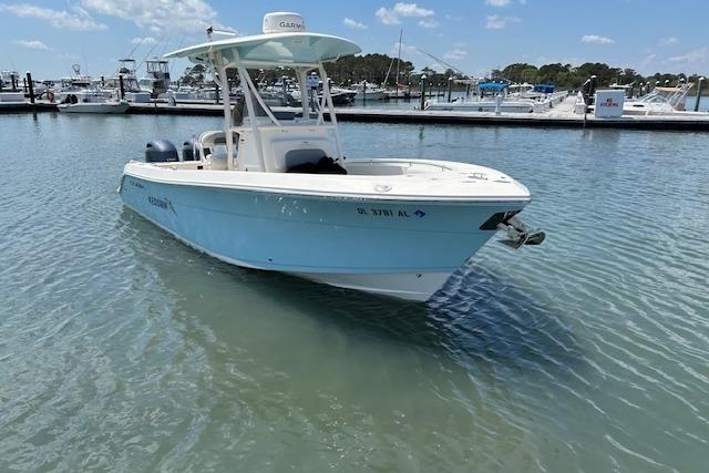 Cobia 237 Center Console 2018 Cobia 237 Center Console boat docked in a marina under clear skies.