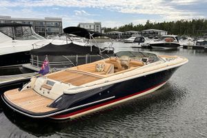 Chris-Craft Launch 28 2013 Chris-Craft Launch 28 boat docked in marina, featuring elegant design and luxurious seating.