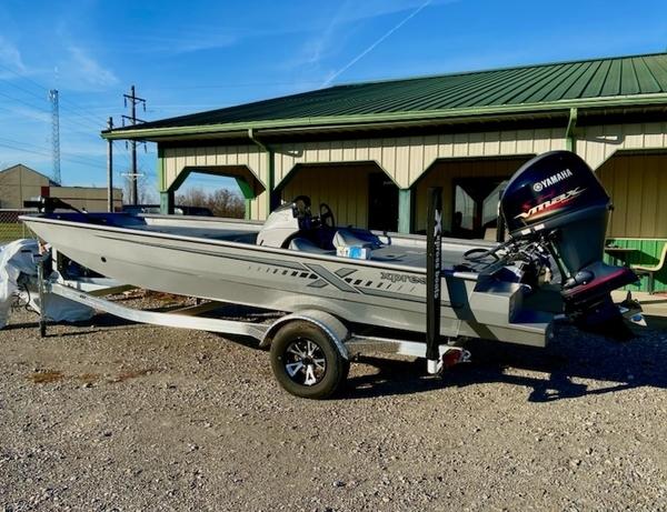 Xpress XP185 Catfish 2023 Xpress XP185 Catfish boat with Yamaha engine on trailer, parked outdoors.