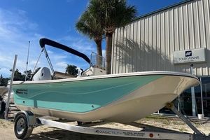 Carolina Skiff 17 LS 2026 Carolina Skiff 17 LS boat on trailer, parked near a building with palm trees.