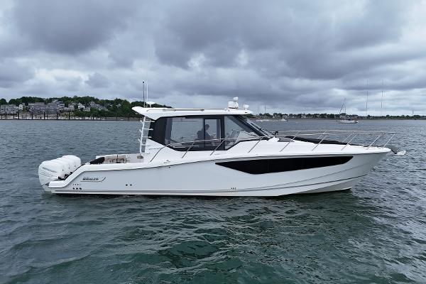 Boston Whaler 405 Conquest 2021 Boston Whaler 405 Conquest boat on water under cloudy sky.