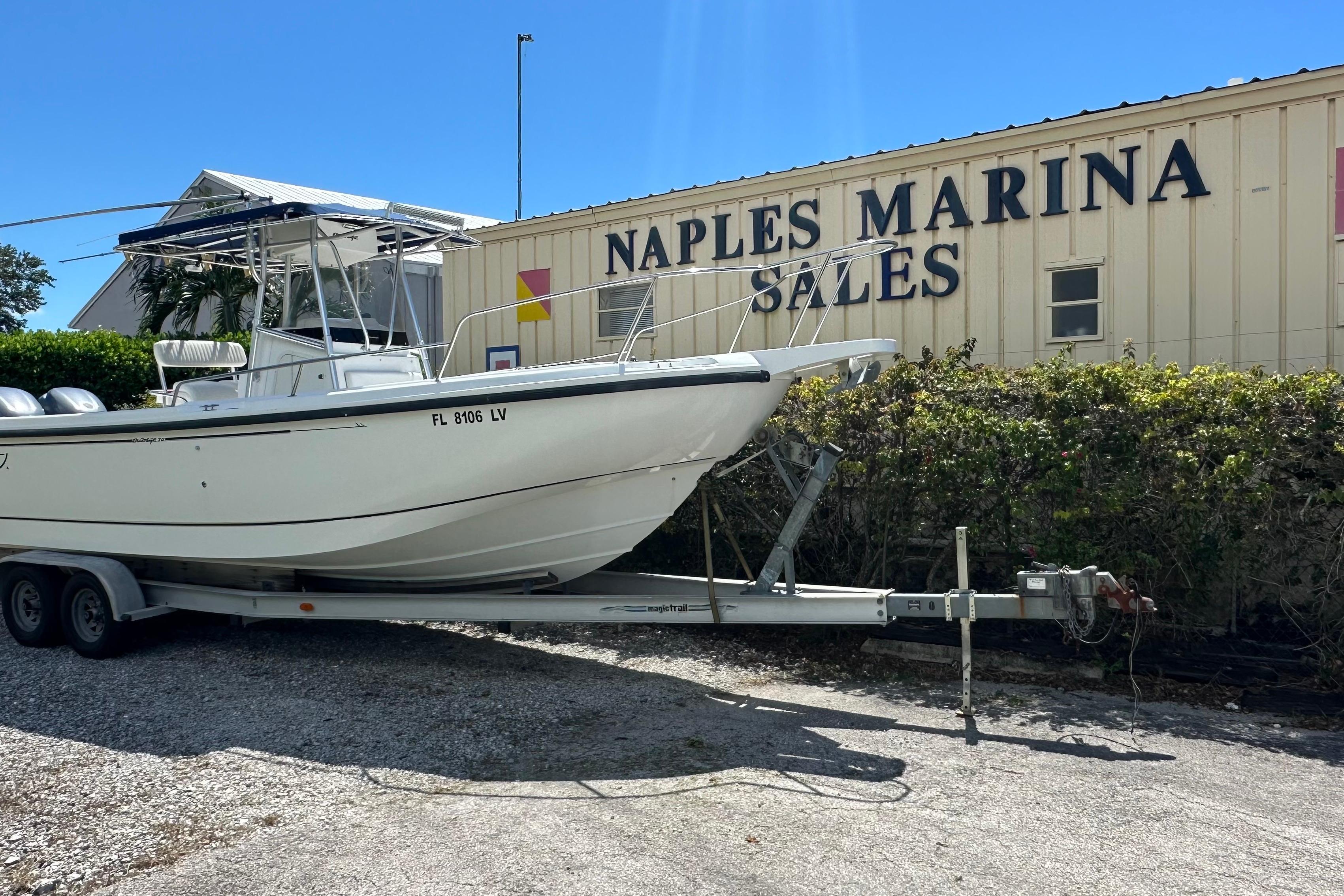 Boston Whaler 26 Outrage 2001 Boston Whaler 26 Outrage boat on trailer at Naples Marina Sales.