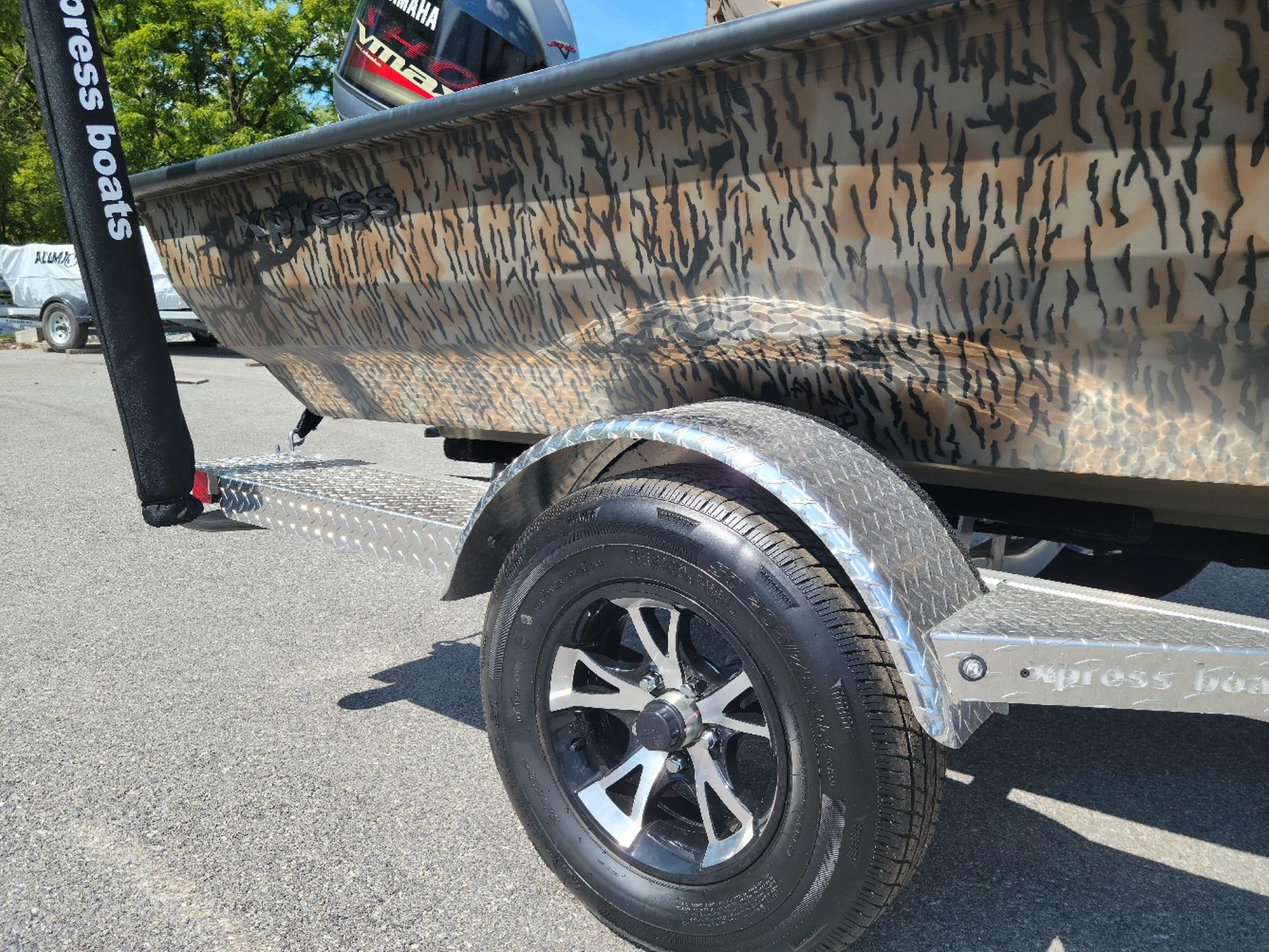 Smoker Craft H20 Bass w/ Yamaha Vmax 150 (On order) ETA December 2025 Xpress H20 Bass boat with Yamaha Vmax 150, camo design, on trailer.