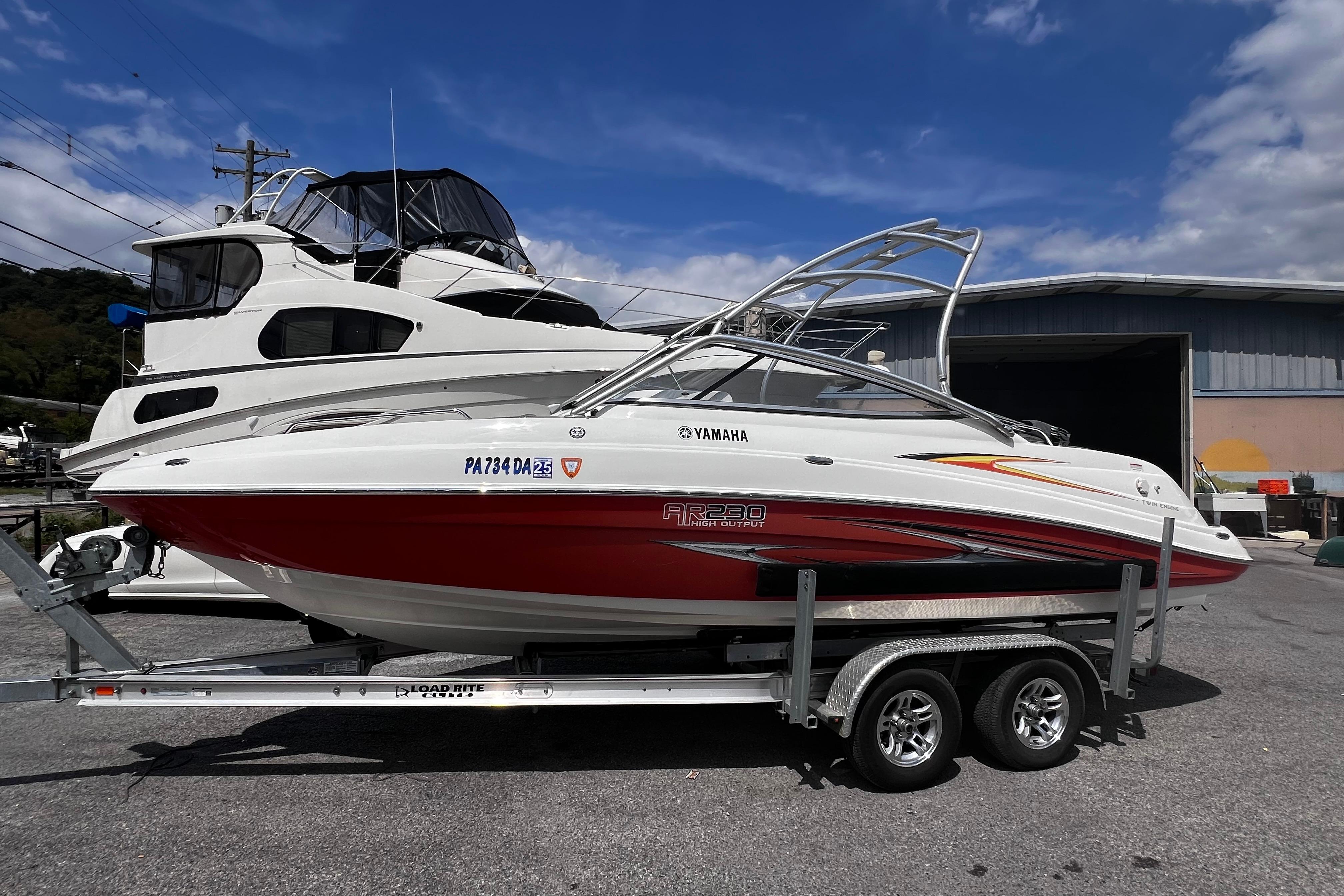 Yamaha Boats AR230 HO 2007 Yamaha Boats AR230 HO on trailer, parked outdoors under a clear sky.