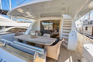 Maiora 26S Luxurious 2004 Maiora 26S yacht deck with elegant outdoor dining area.