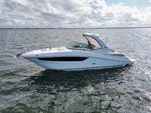 Sea Ray 330 Sundancer 2016 Sea Ray 330 Sundancer cruising on open water under cloudy skies.
