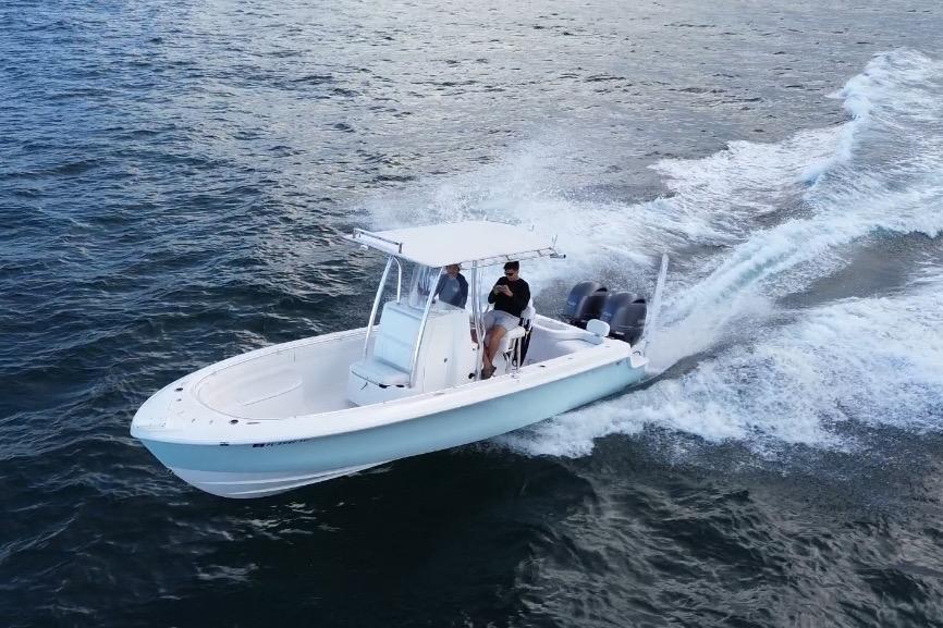Contender 24 Sport 2023 Contender 24 Sport boat cruising on open water, showcasing speed and performance.