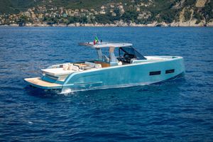 Pardo Yachts 43 2026 Pardo Yachts 43 cruising on blue ocean near scenic coastline.