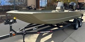 Tracker Grizzly 2072 CC 2024 Tracker Grizzly 2072 CC boat on trailer, parked outdoors.