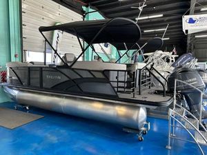 Sylvan Mirage L-1 LZ 2025 Sylvan Mirage L-1 LZ pontoon boat displayed indoors with Yamaha engine.