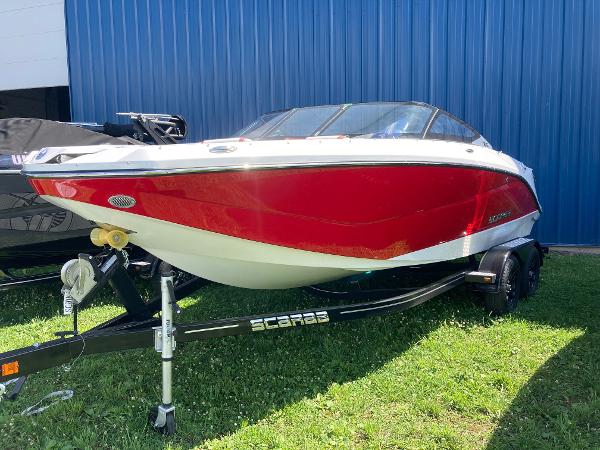Scarab 215 2024 Scarab 215 boat in red and white on a trailer.