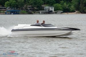 Spectre Screaming Eagle 22 Talon 2019 Spectre Screaming Eagle 22 Talon speedboat cruising on a lake.