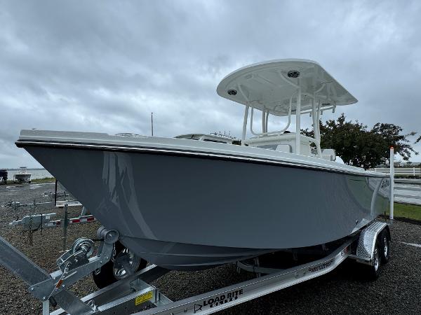 Parker 23 SE CC 2025 Parker 23 SE CC boat on trailer under cloudy sky.