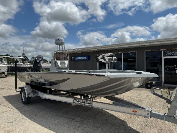 Polar Kraft SPORTX210CC 2023 Polar Kraft SPORTX210CC boat on a trailer outside a dealership.