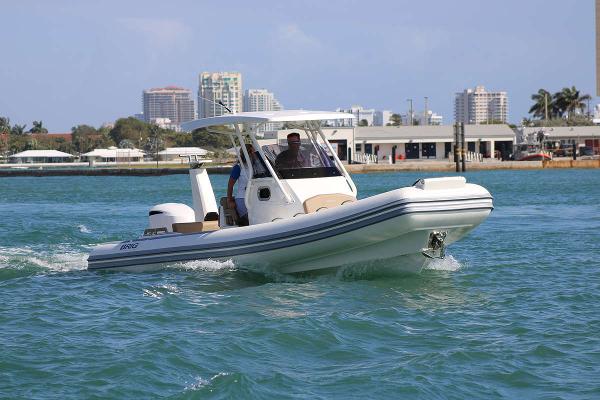 Brig Eagle 8 2026 Brig Eagle 8 boat cruising on clear blue water near urban skyline.