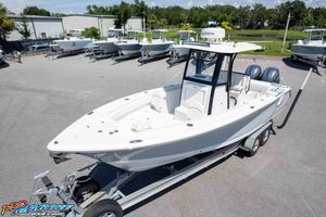 Sea Hunt Gamefish 27 Forward Seating 2022 Sea Hunt Gamefish 27 boat on trailer in outdoor showroom.