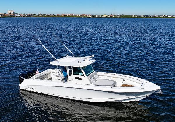 Boston Whaler 370 Outrage 2012 Boston Whaler 370 Outrage boat cruising on a calm lake.
