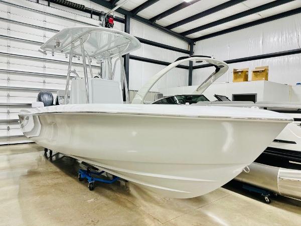 Contender 24S 2024 Contender 24S boat in a warehouse, showcasing sleek design and modern features.