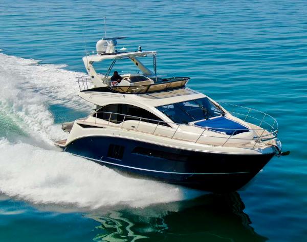 Sea Ray 510 Fly 2015 Sea Ray 510 Fly yacht cruising on clear blue water.
