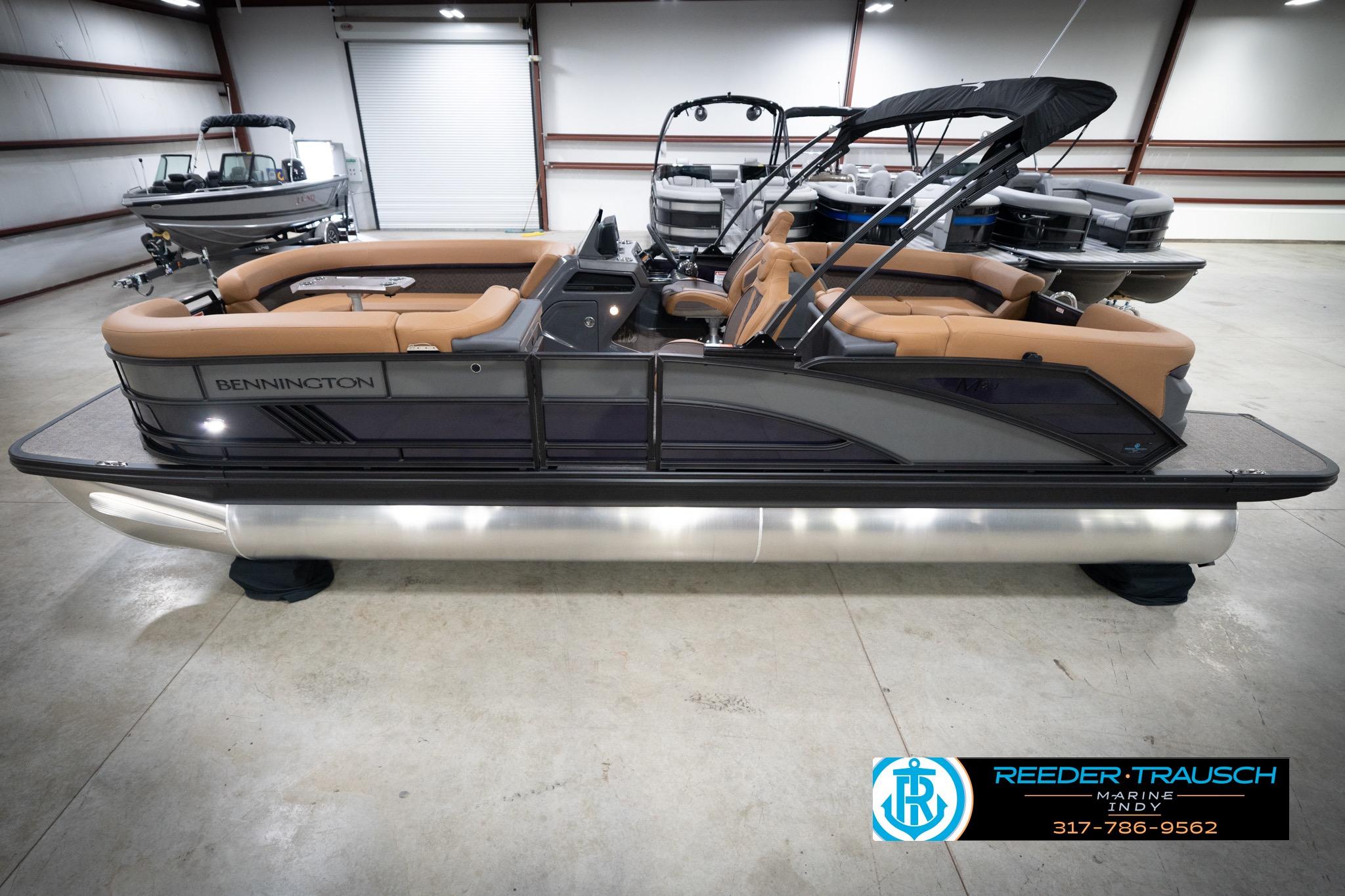 Bennington 22 MFB 2026 Bennington 22 MFB pontoon boat with tan seating in a showroom.