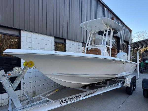 Key West 230 Bay Reef 2025 Key West 230 Bay Reef boat on trailer outside a building.