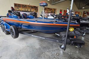 Ranger Z520R Cup-Equipped 2025 Ranger Z520R Cup-Equipped boat on trailer, blue with orange accents, in showroom.