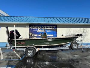 Mako 18 Pro Skiff Backwater Edition 2025 Mako 18 Pro Skiff Backwater Edition boat on trailer, parked outside dealership.