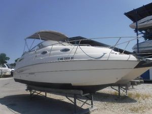 Stingray 250 CS 2008 Stingray 250 CS boat on dry dock under clear blue sky.