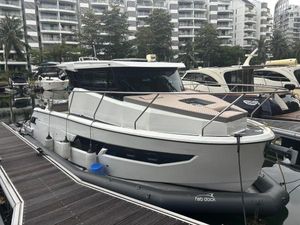 Atak Yachts T28 Cruiser 2023 Atak Yachts T28 Cruiser docked at marina, surrounded by modern buildings.