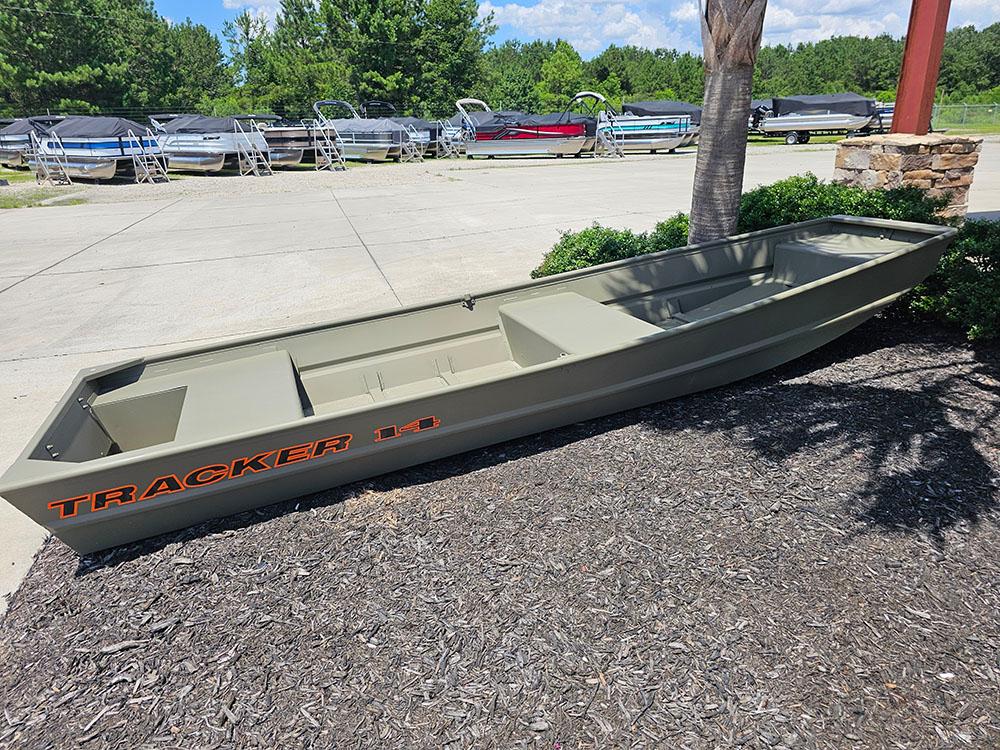 Tracker Grizzly 14 Jon 2025 Tracker Grizzly 14 Jon boat displayed outdoors, surrounded by greenery and other boats.