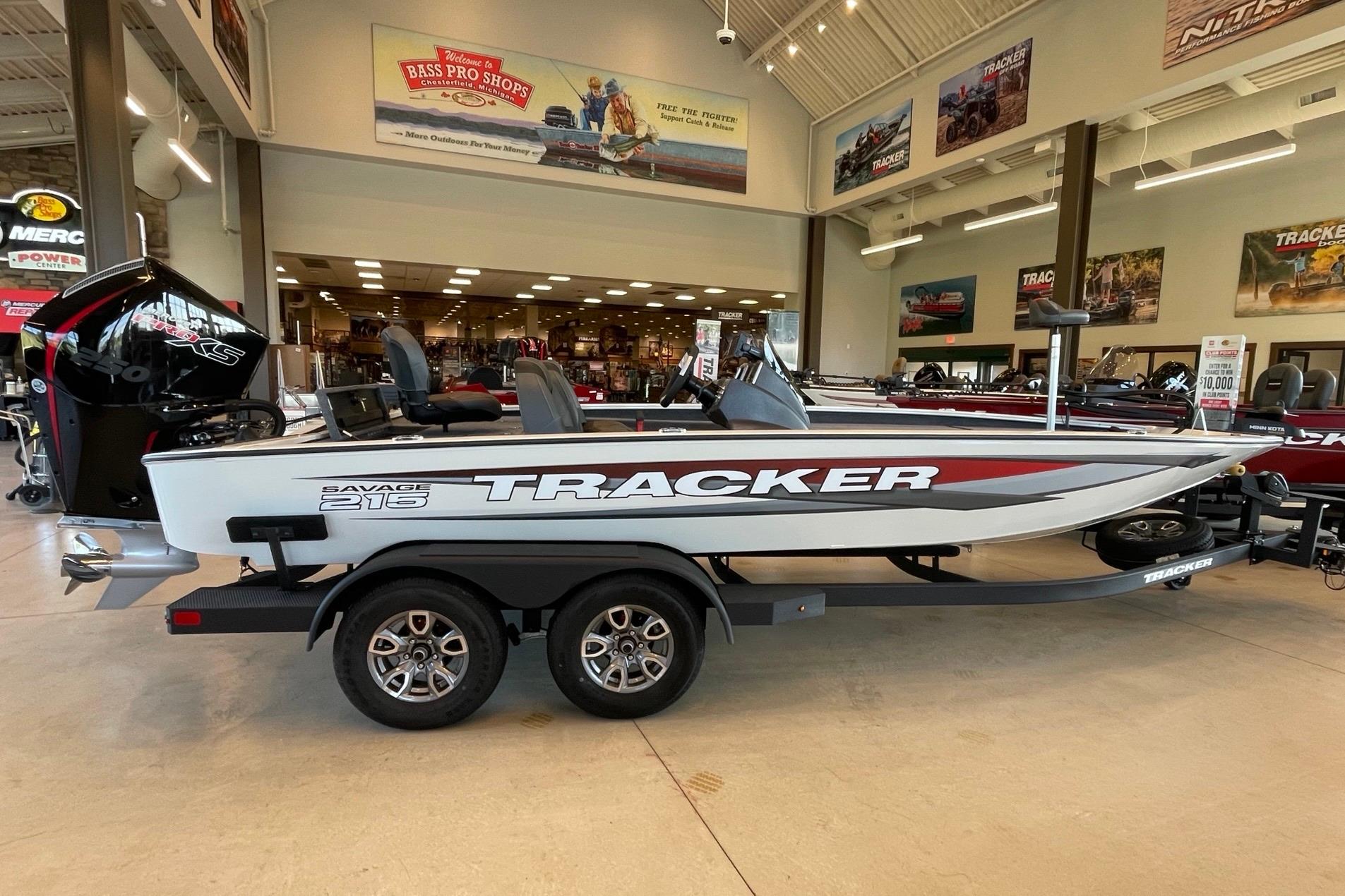 Tracker Savage 215 2025 Tracker Savage 215 boat displayed indoors at Bass Pro Shops showroom.