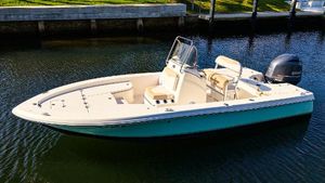 Robalo 206 Cayman 2016 Robalo 206 Cayman boat on calm water, featuring sleek design and outboard motor.