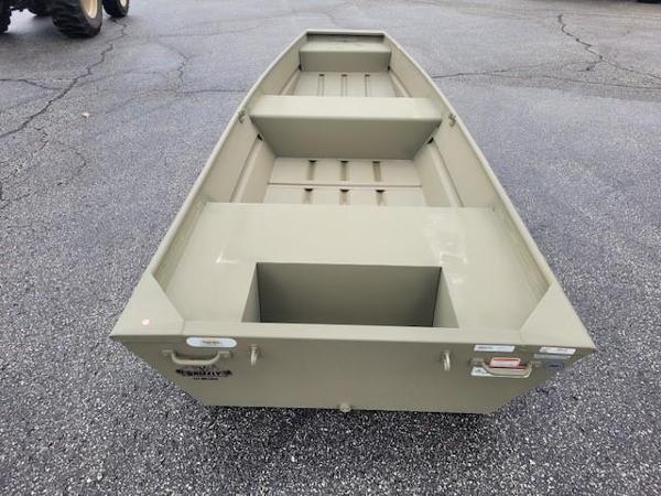 Tracker Grizzly 14 Jon 2025 Tracker Grizzly 14 Jon boat on asphalt, showcasing its sturdy, flat-bottom design.