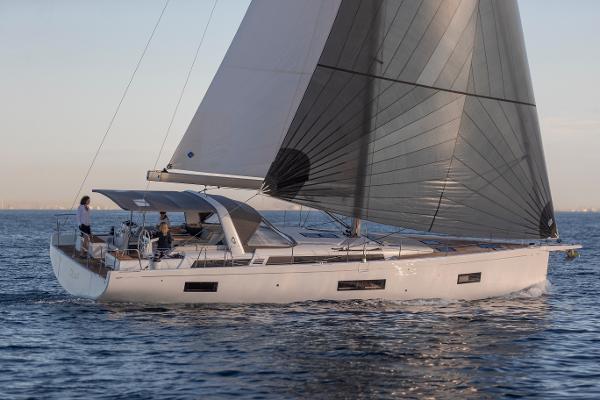 Beneteau Oceanis Yacht 54 2025 Beneteau Oceanis Yacht 54 sailing on calm waters at sunset.