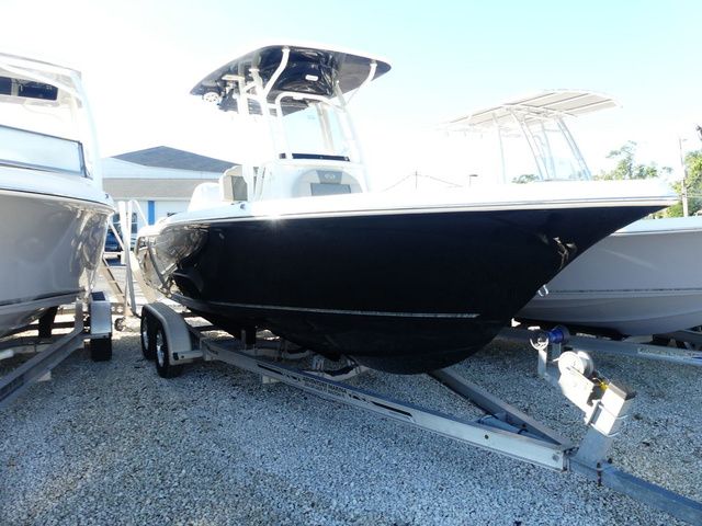 Key West 239 FS 2026 Key West 239 FS boat on trailer, black hull, parked outdoors.