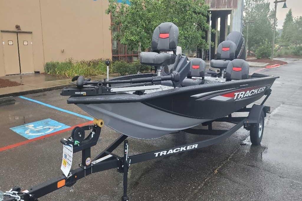 Tracker Pro Team 175 Crappie Edition 2026 Tracker Pro Team 175 Crappie Edition fishing boat on trailer in parking lot.