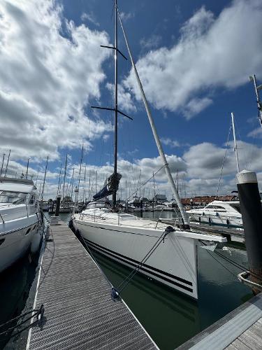 Arcona 465 2018 Arcona 465 yacht docked at marina under cloudy sky.