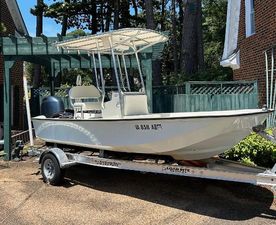 Boston Whaler 17 Montauk 2022 Boston Whaler 17 Montauk boat on trailer, parked in driveway.