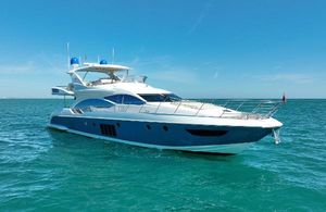 Azimut 70 2014 Azimut 70 yacht cruising on clear blue ocean waters.