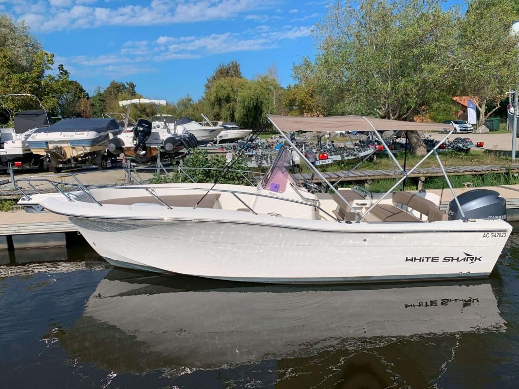 White Shark 230 CC ORIGIN 2022 White Shark 230 CC ORIGIN boat docked on a sunny day.