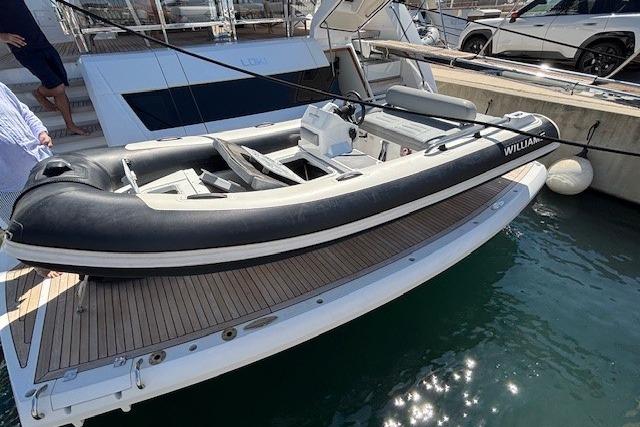 Williams Jet Tenders Sportjet 435 2022 Williams Jet Tenders Sportjet 435 docked at marina, sleek design, black and white color.